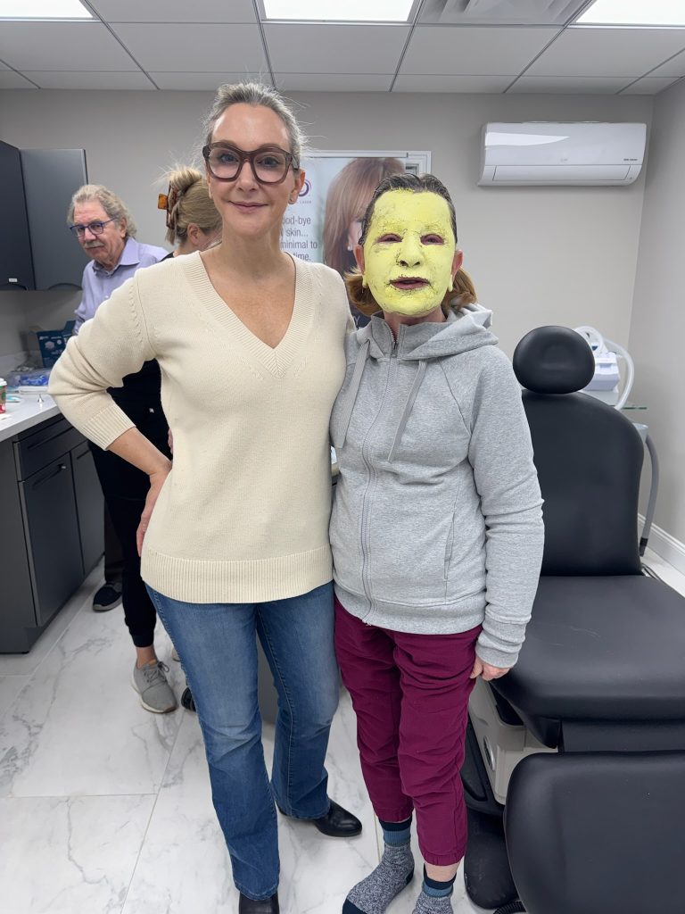 Dr. Beth Collins poses with a patient following a croton oil peel.